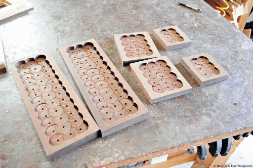 The 3 different card cases with the waste stock removed by the drill press.